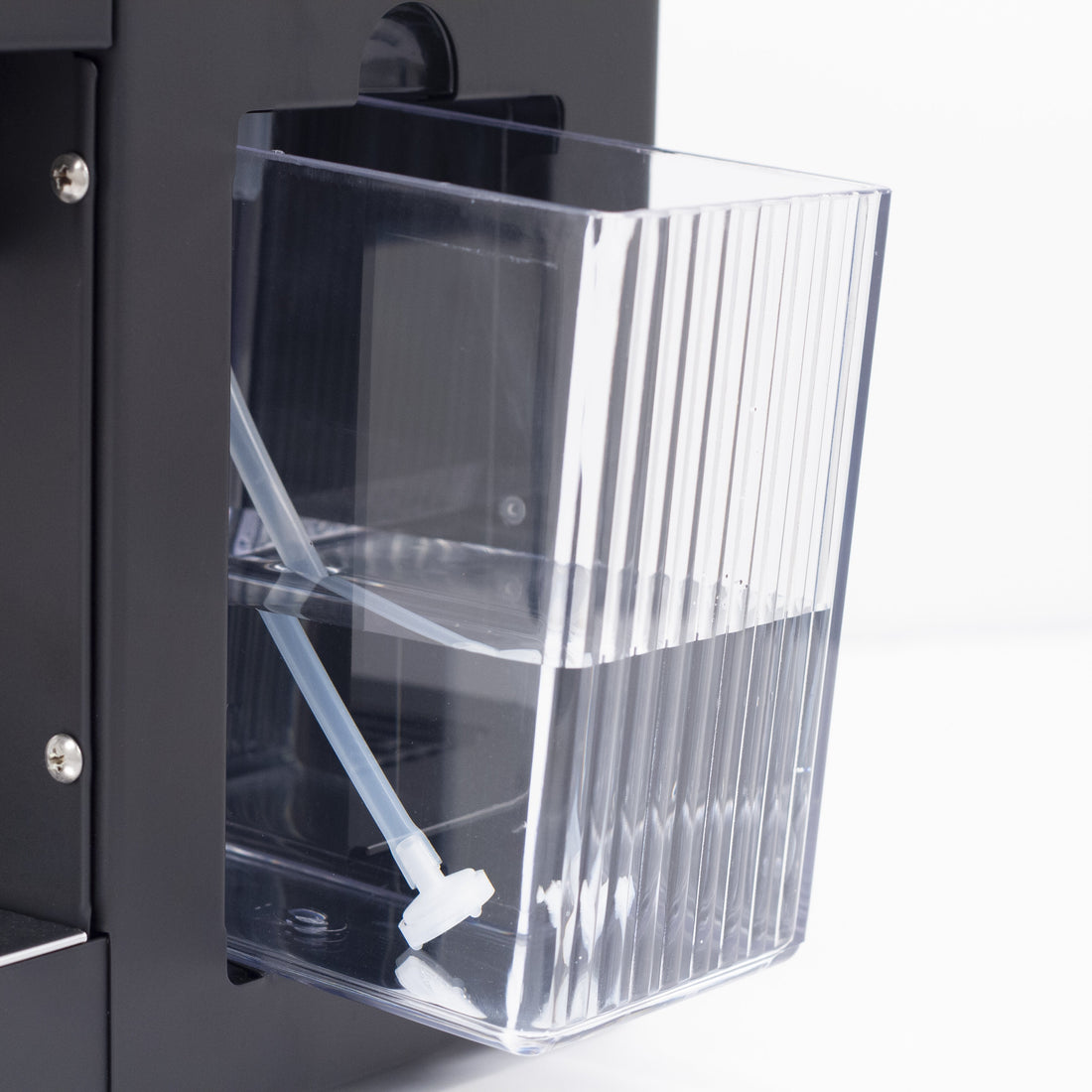 The clear water reservoir pulls out from the side of the machine and is easy to refill.