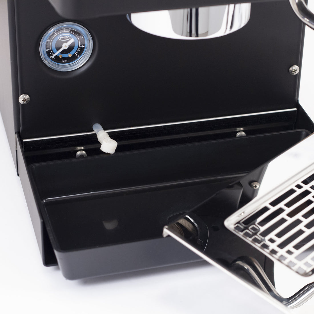 The solenoid relief tube drains directly into the drip tray.