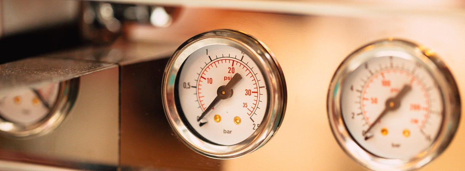 Closeup of pressure guages on an espresso machine