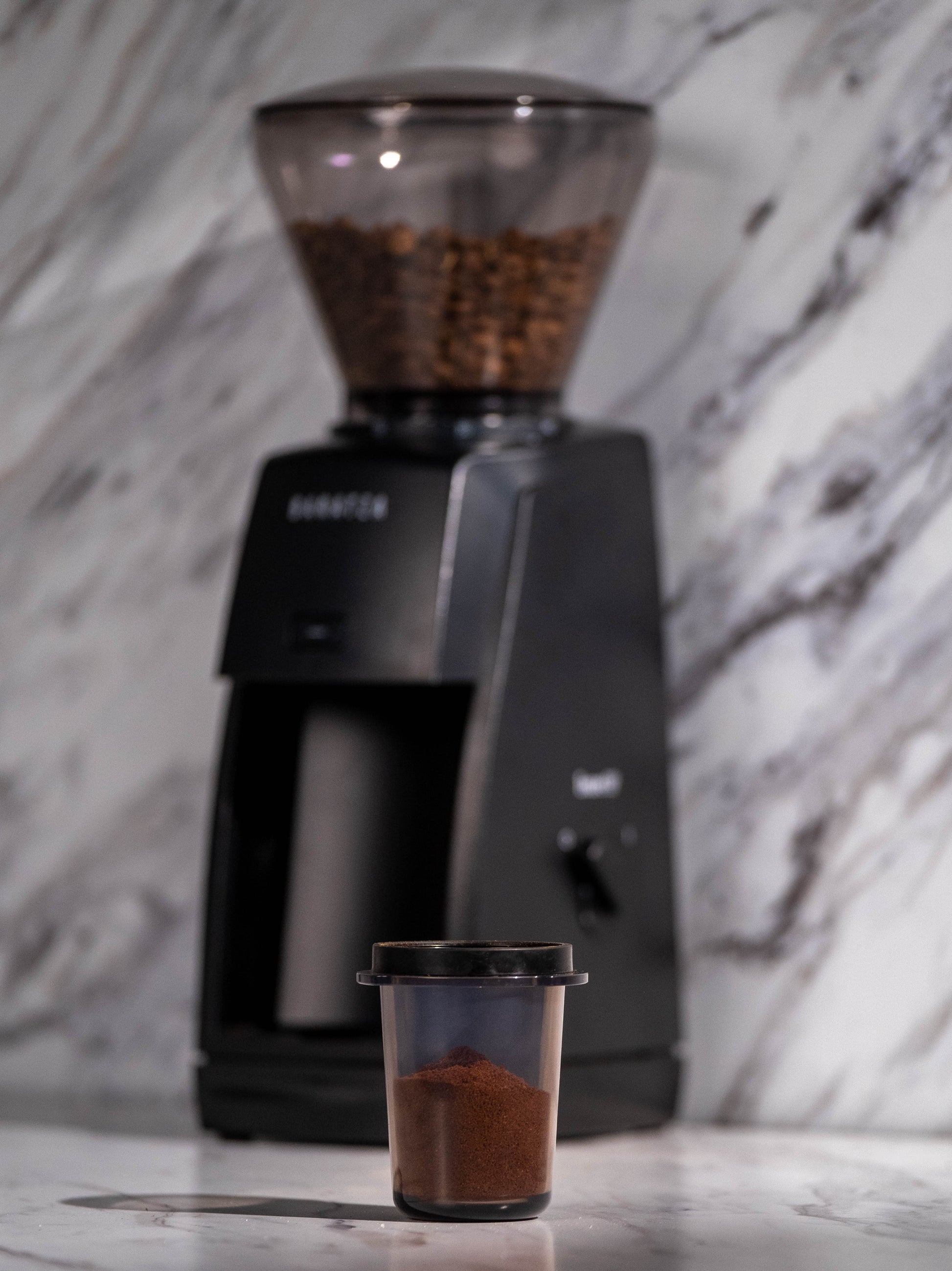 Baratza Encore ESP Coffee and Espresso Grinder in Black Dosing Cup Lifestyle || Black