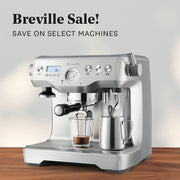 Breville Dual Boiler on a wooden counter in front of a white wall. Promotional text that reads "Breville Sale!".