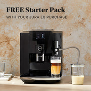JURA E8 in Black in front of a brown wall on a counter top. Promotional text that reads "FREE Starter Pack - with your JURA E8 Purchase".
