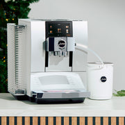 JURA Z10 super-automatic machine on a counter, in front of a Christmas tree