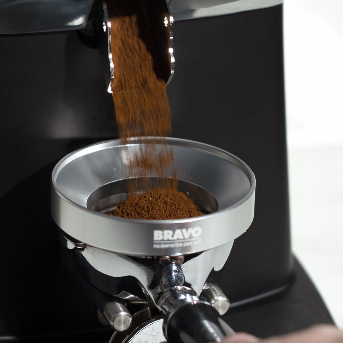 Grinding into a portafilter with the dosing funnel on top.