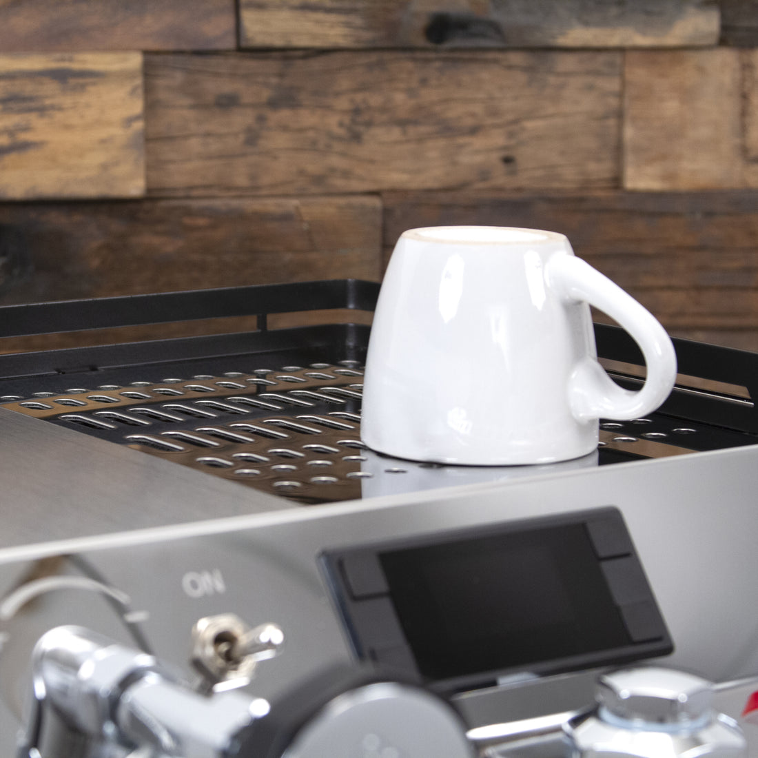 Passively heated stainless steel cup tray.